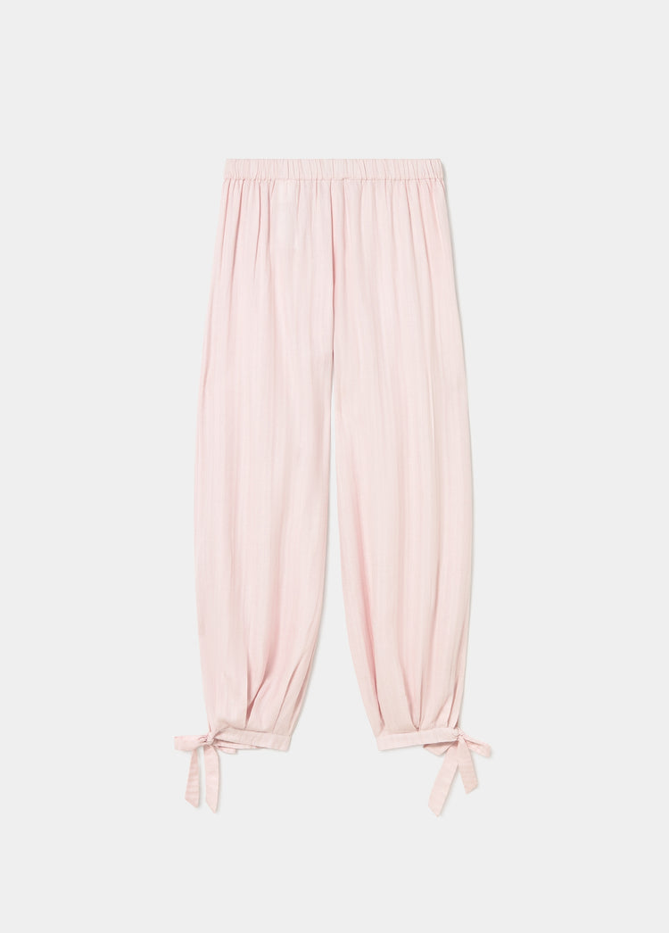 Pantalón largo bombacho de color rosa con puños abotonados en los tobillos