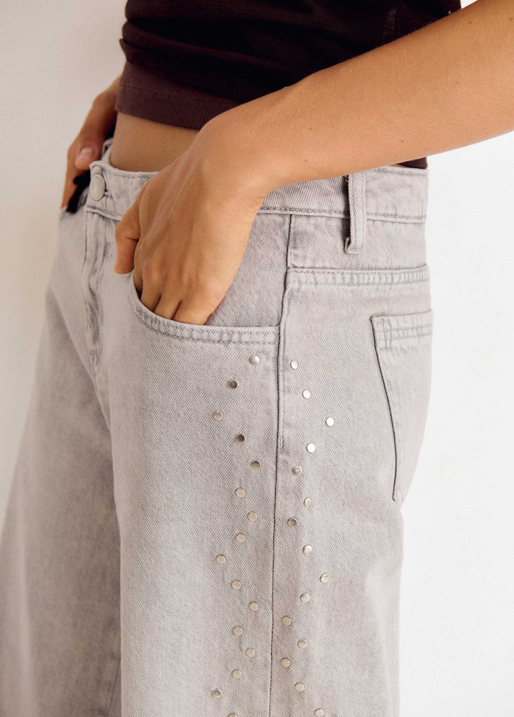 Jeans tachas laterales