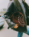 Shoulder bag with spiral studs