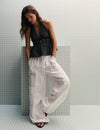 Pantalón bombacho lino detalle tachas