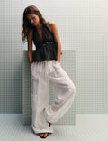 Pantalón bombacho lino detalle tachas