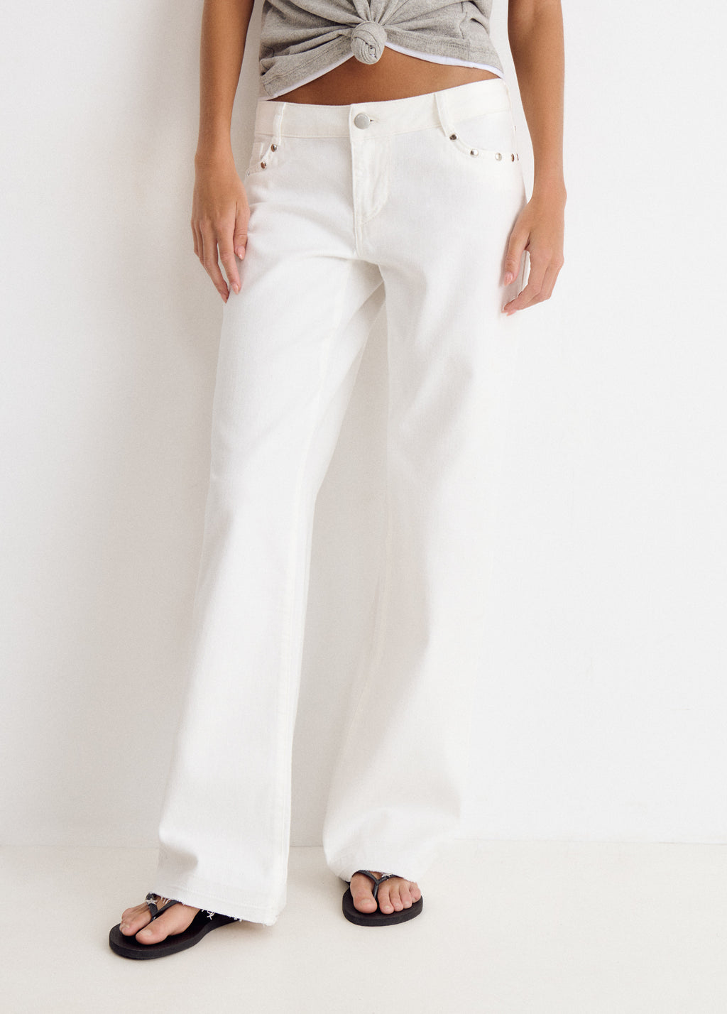 Low-rise pants with glitter stars and studs