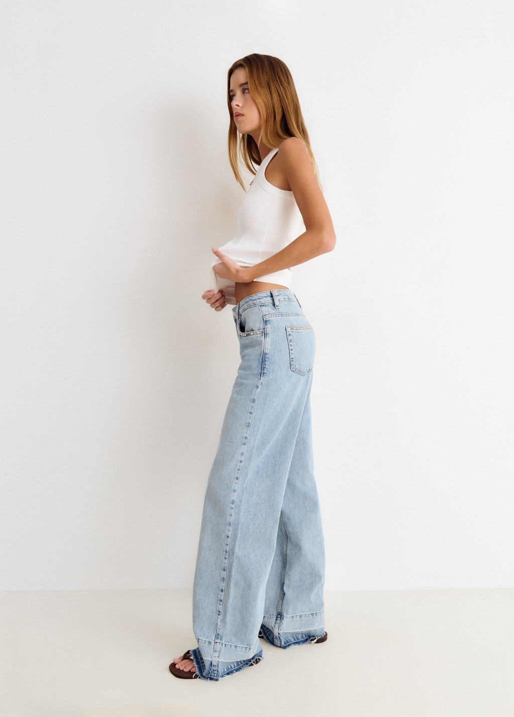 Relaxed jeans with studs and folded hem
