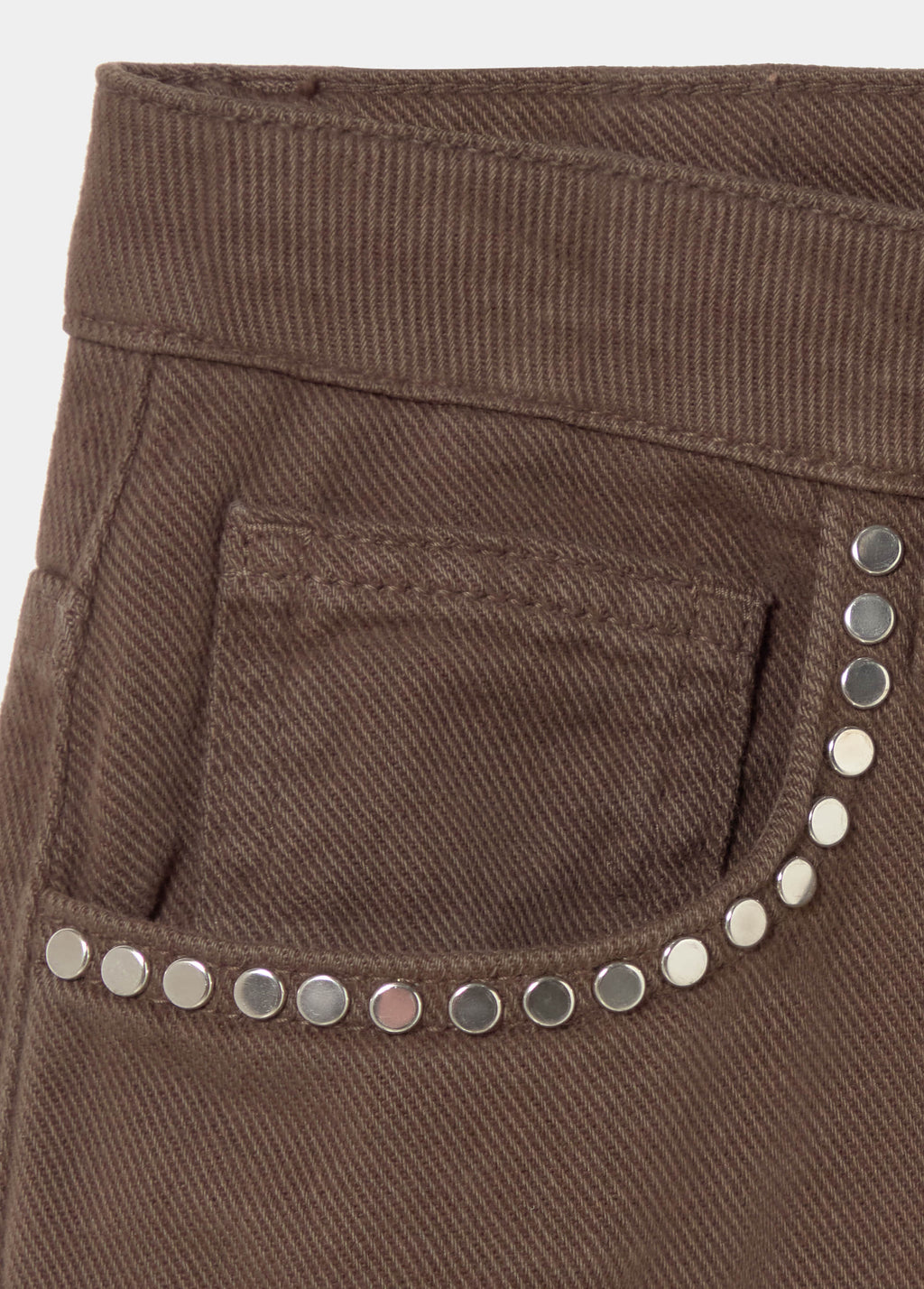 Relaxed pants with studs and rolled-up hem
