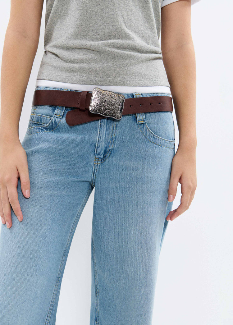 Belt with metal piece