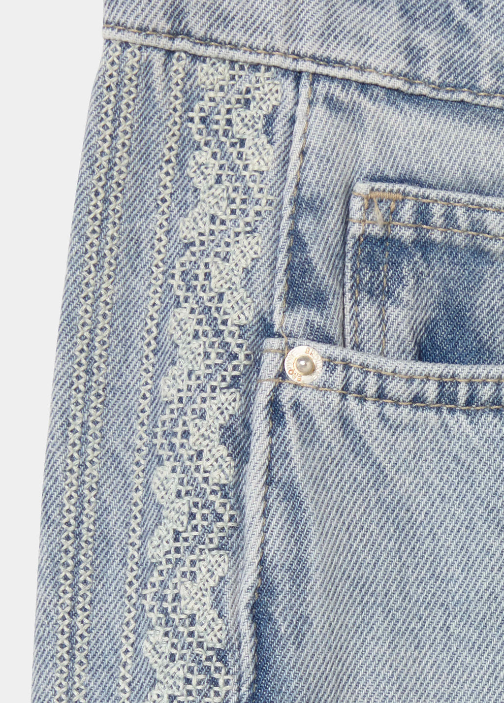 Jeans with side cross stitch panel