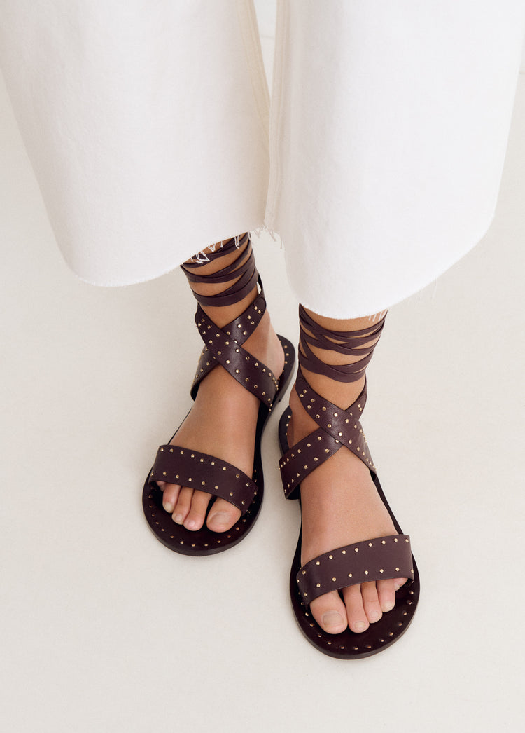 Flat sandals with studs and ties