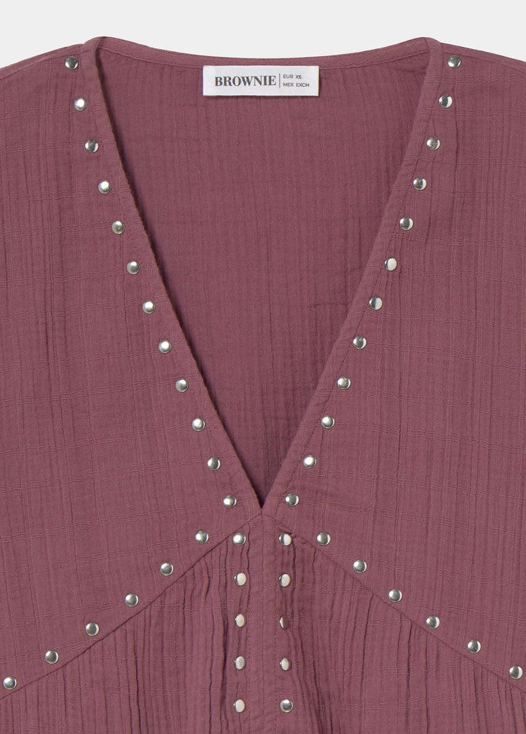 Blusa a maniche lunghe con borchie