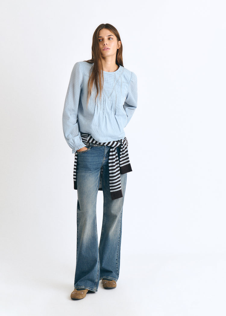 Blouse with lace and a high neckline