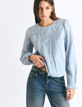Blouse with lace and a high neckline