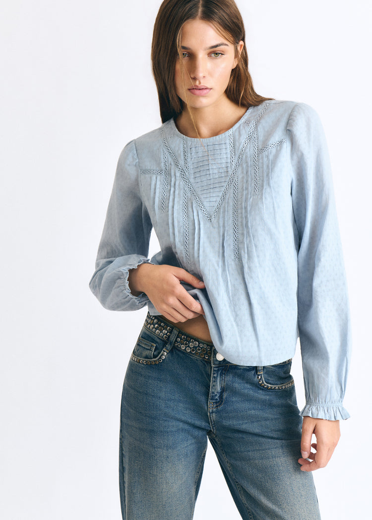 Blouse with lace and a high neckline