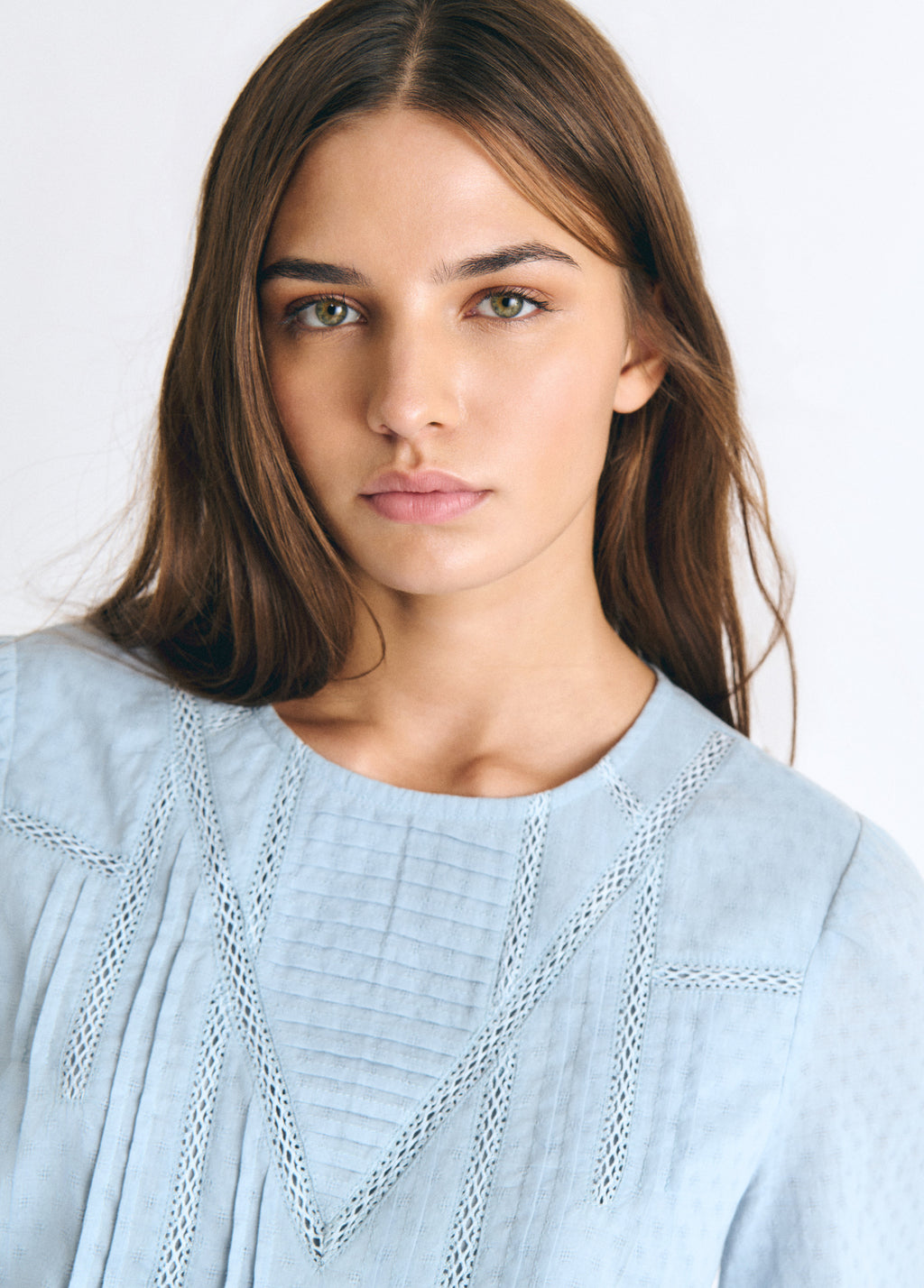 Blouse with lace and a high neckline
