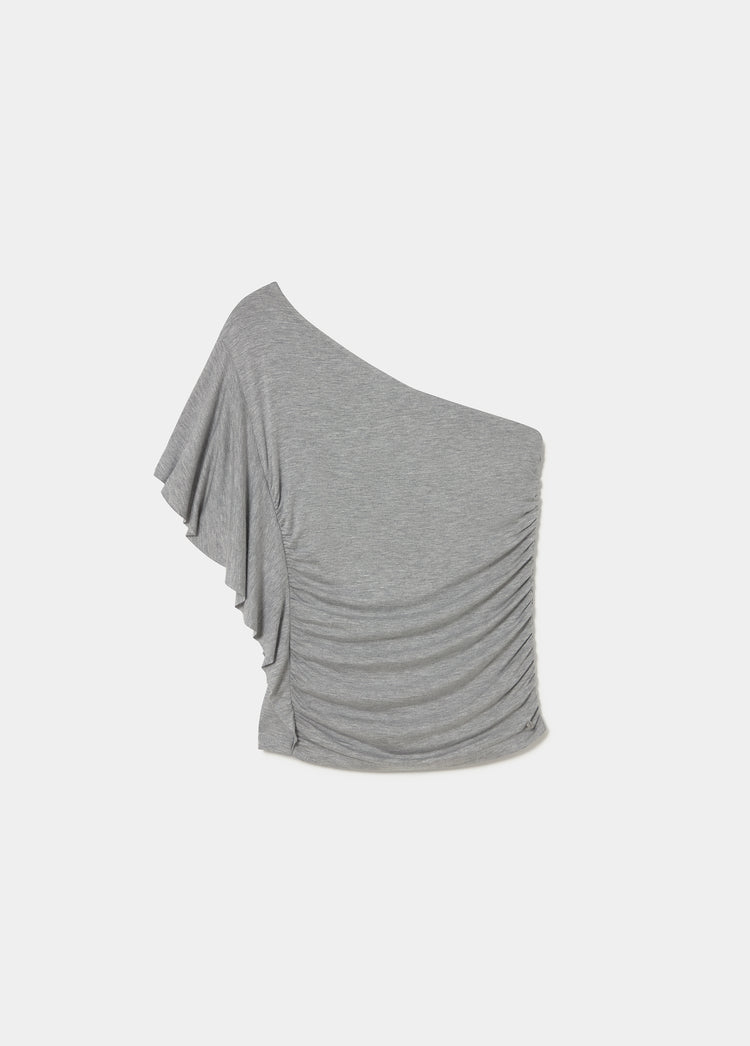 Top asimmetrico con volant