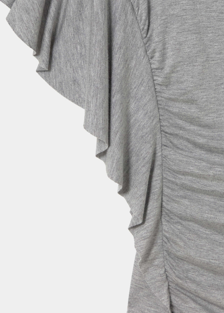 Top asimmetrico con volant