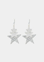 Pendientes aro de color plata con colgante de estrella facetada lucidos en la oreja