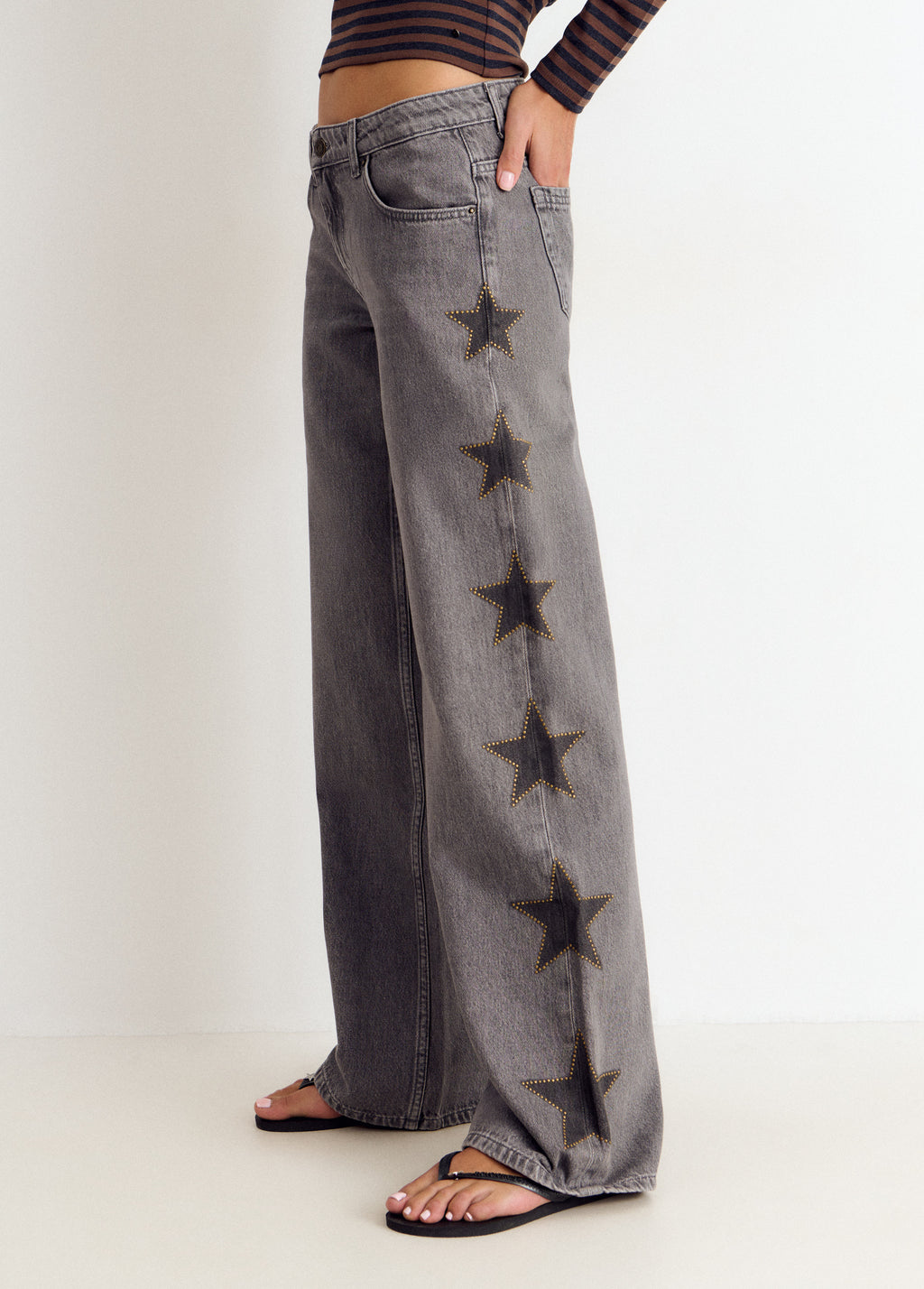 Jeans estrellas tachas lateral