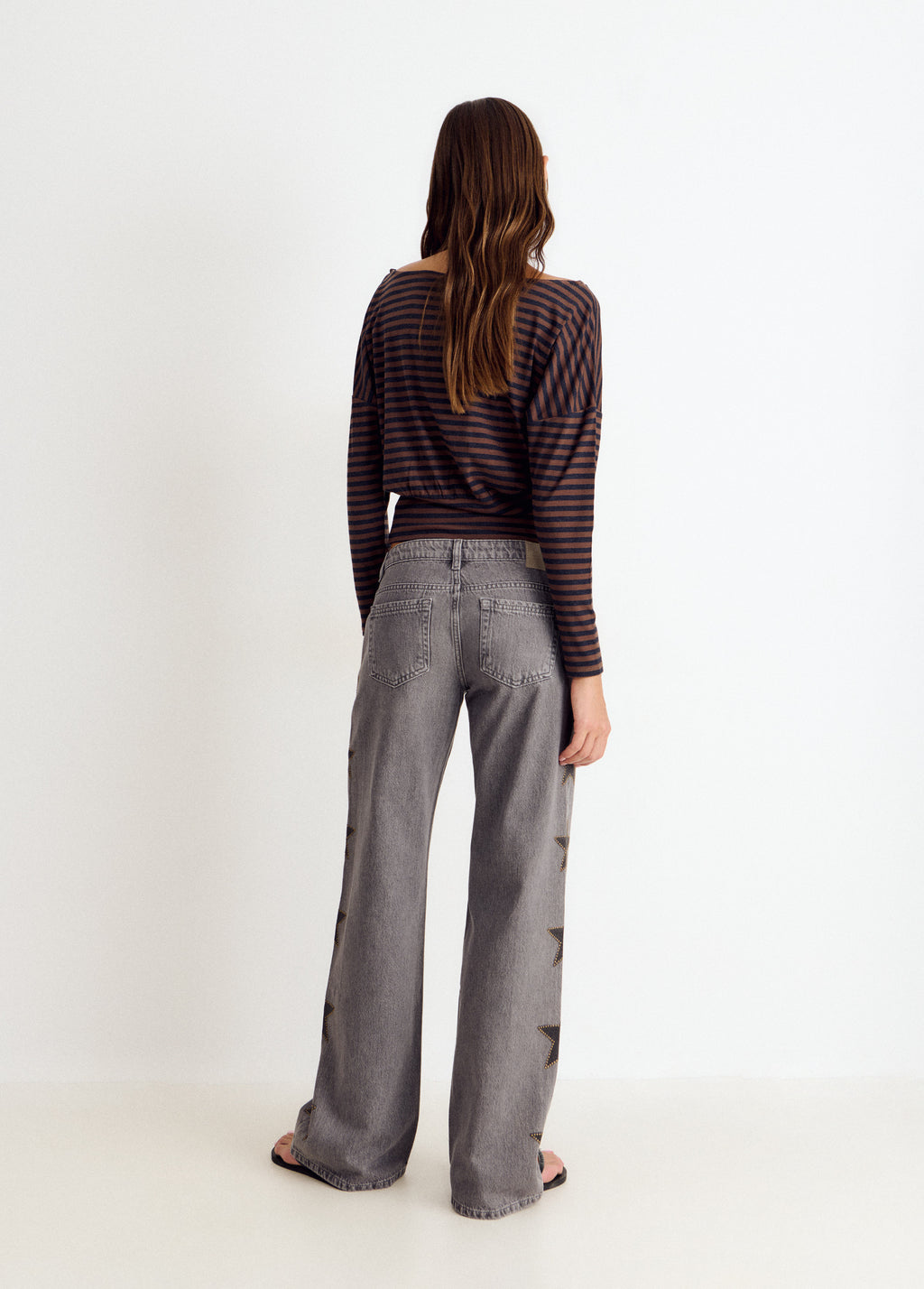 Jeans estrellas tachas lateral