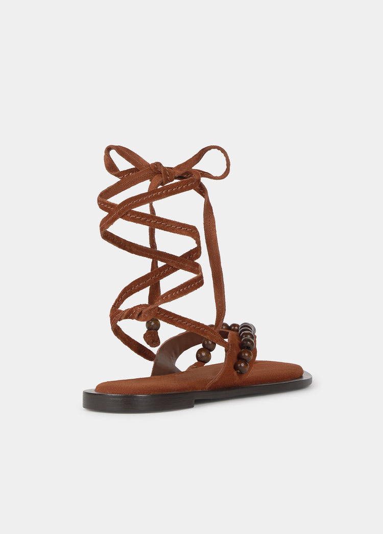 Flat sandals with wooden beads