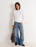 Pull en maille torsadée brodé
