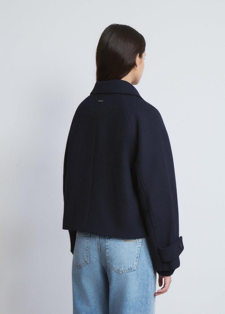 Short coat with toggle fastenings