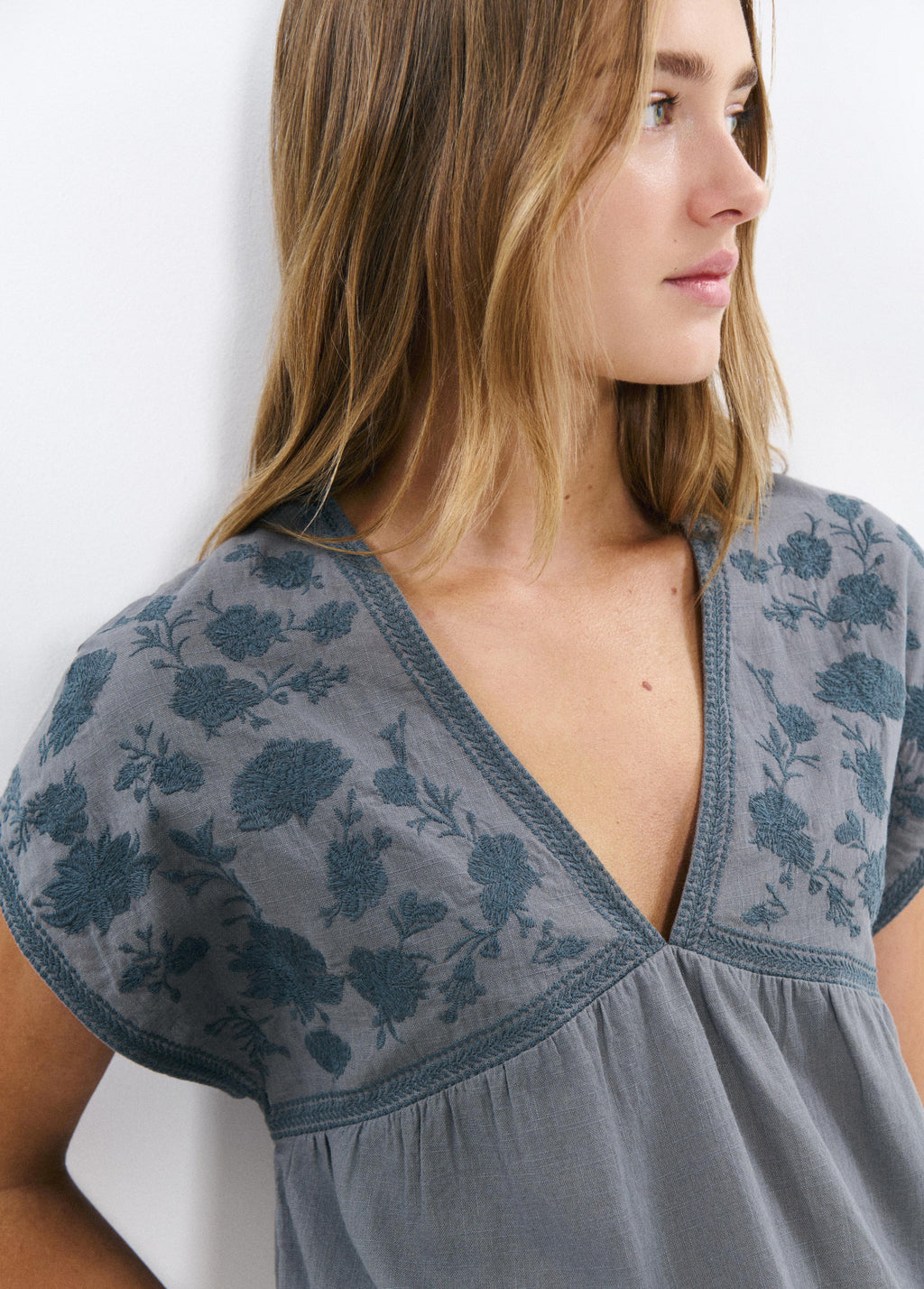 Blouse with embroidered neckline
