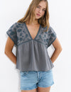 Blouse with embroidered neckline