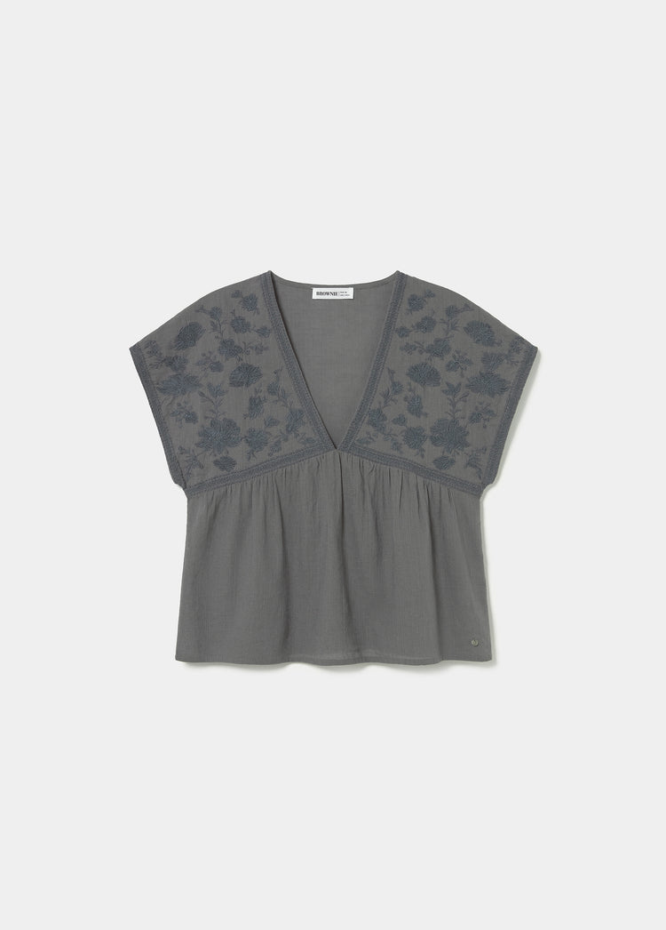 Blouse with embroidered neckline