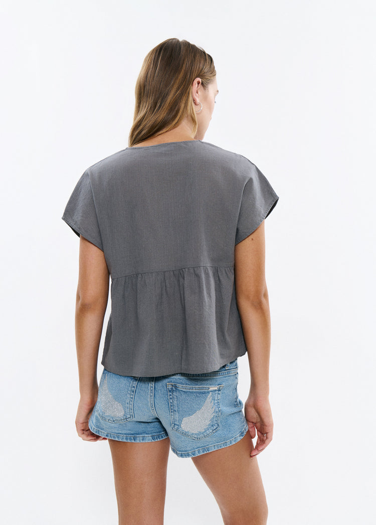 Blouse with embroidered neckline