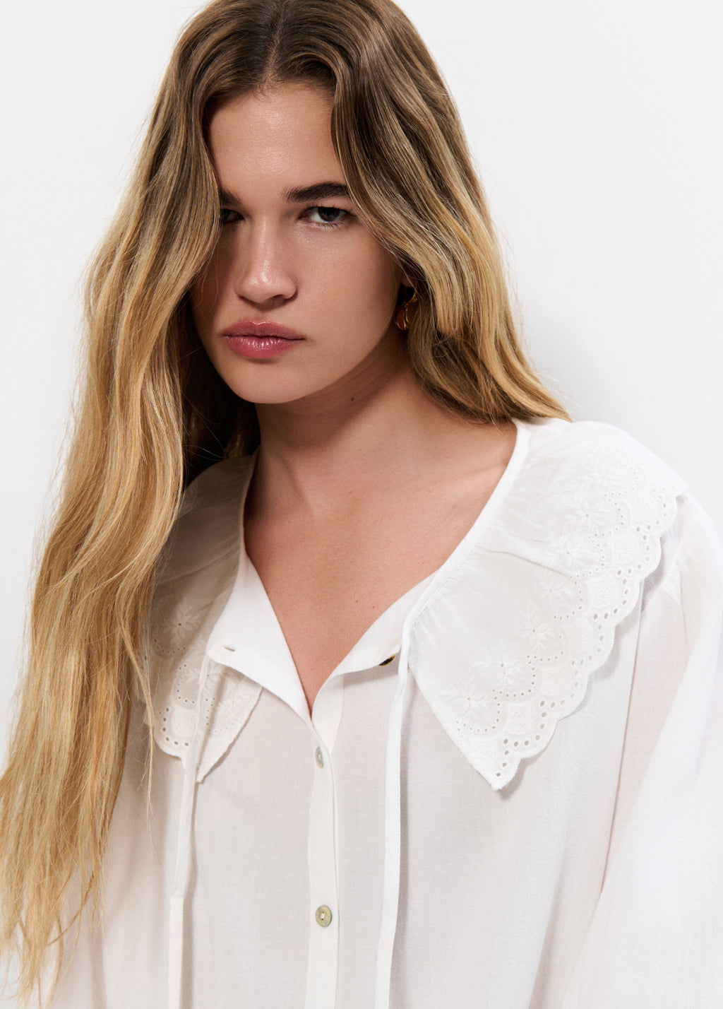 Embroidered blouse with bow