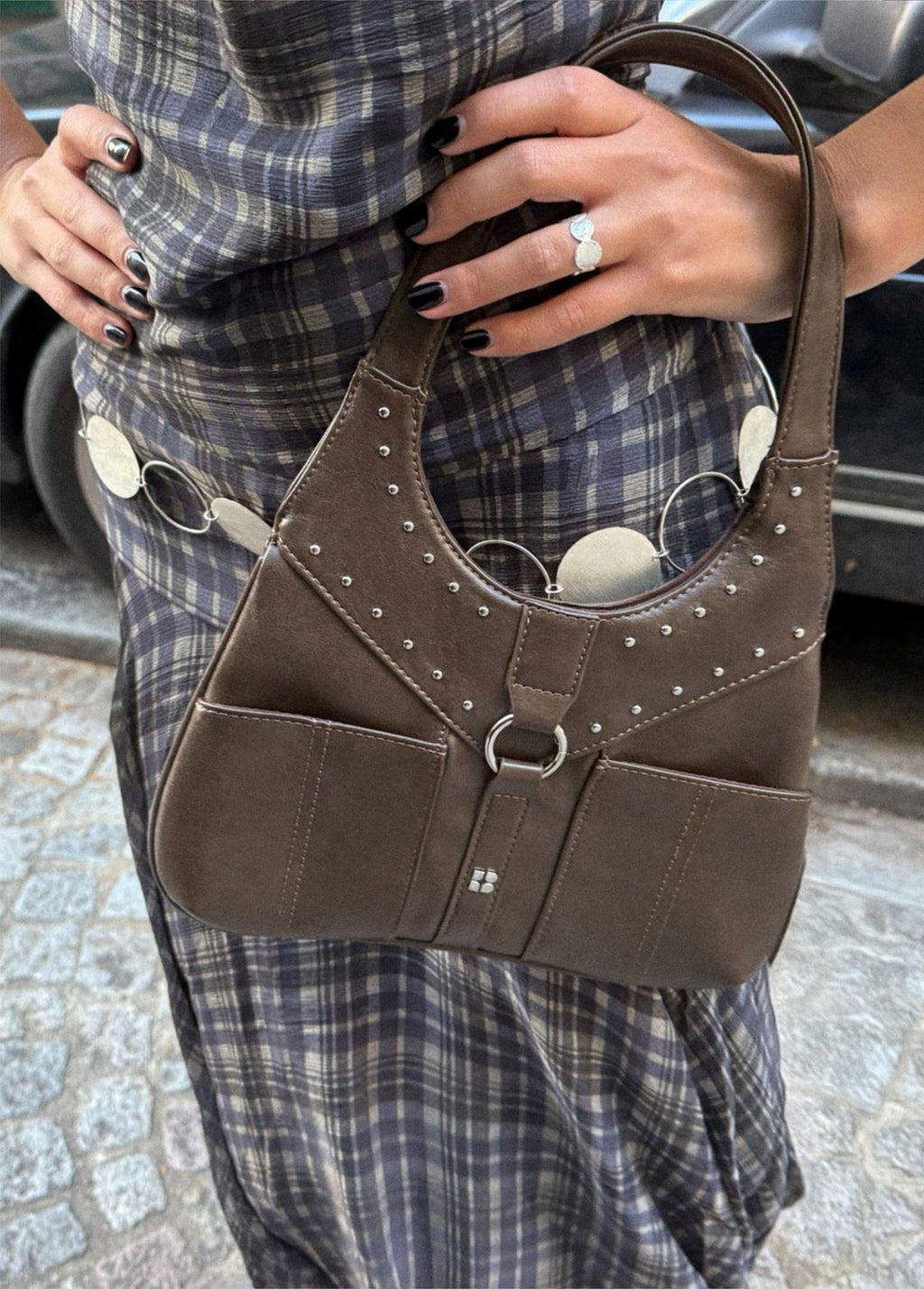 Shoulder bag with studded buckle