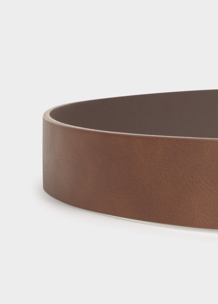 Belt with metal piece