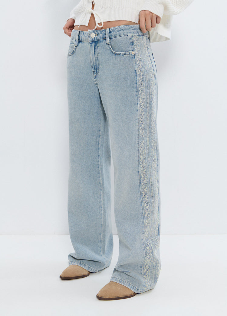 Jeans with side cross stitch panel
