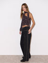 Jeans con borchie a stelle