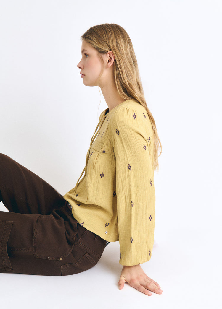 Embroidered smocked blouse