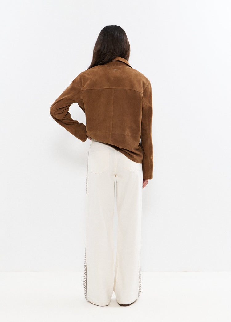 Broek met borduursels aan de zijkant