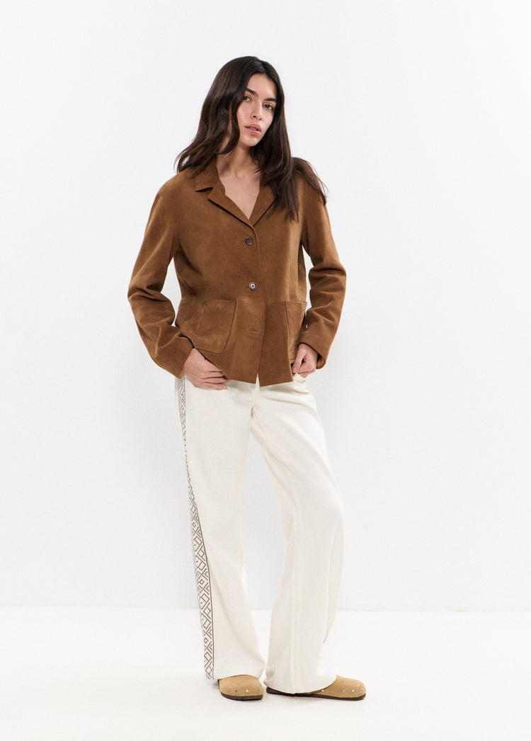 Broek met borduursels aan de zijkant