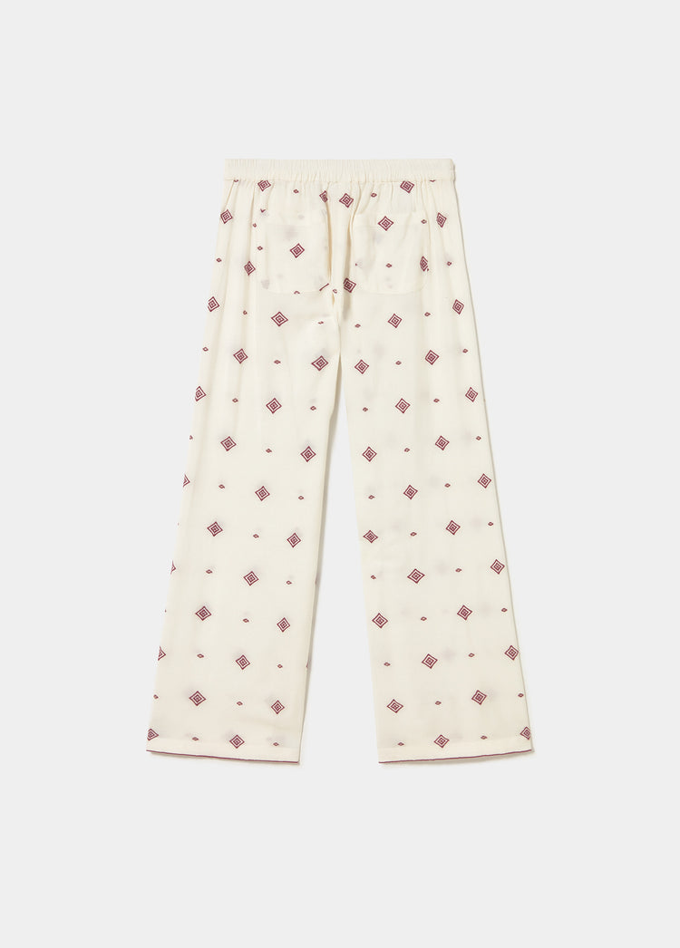 Lange broek met geborduurde bies