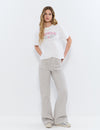 Pantaloni dritti con borchie