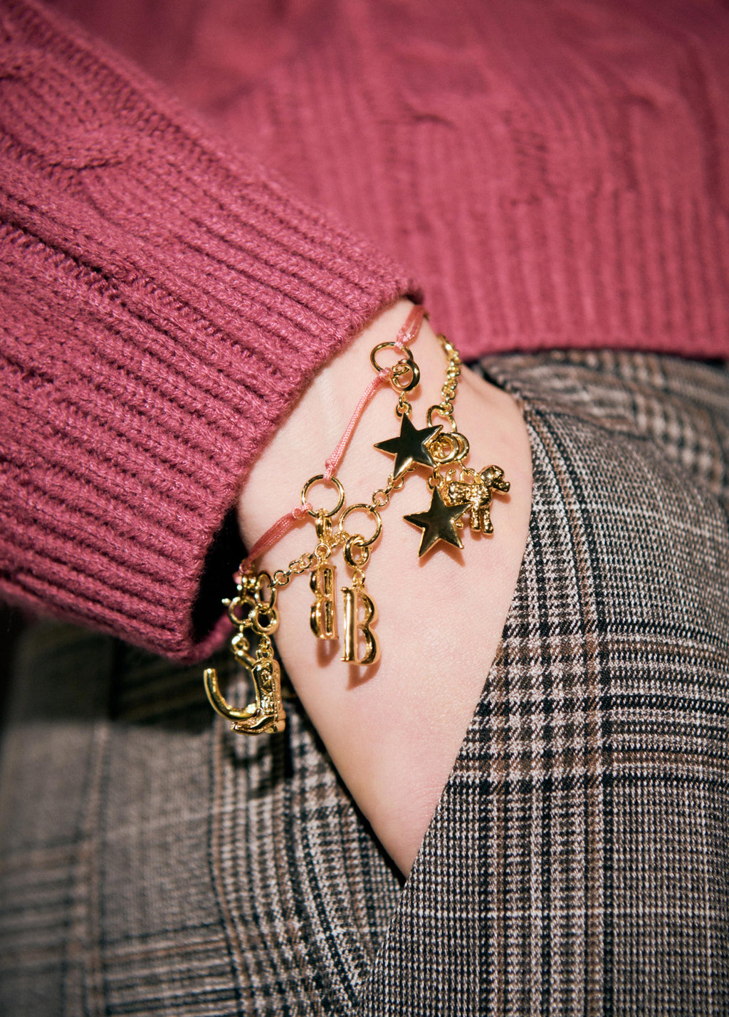 Cord bracelet with charms