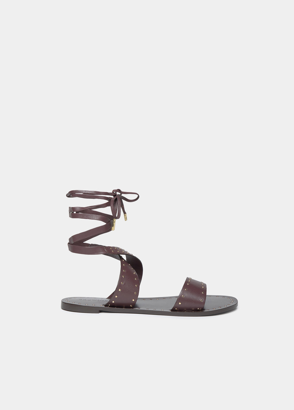 Flat sandals with studs and ties